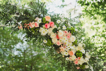 Coziness and style. Modern event design. Lounge zone and european traditional wedding ceremony decoration outdoors in the restaurant before the reception.