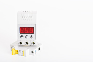 .Automatic circuit breakers, distribution box, cable and digital multimeter on a white background....