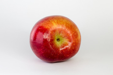 red Apple on a white background, close-up