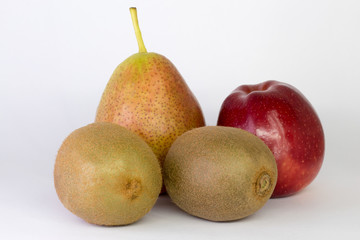kiwi, pear, apple on a white background, close-up