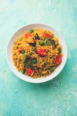 Tomato  pulav/Pilaf made using basmati rice, served in a bowl. selective focus