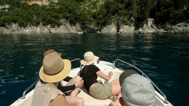 Three women and man sailing on a boat on the Mediterranean sea in Greece. Slow motion. HD