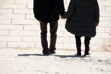 Lover holding hand and walk step by step in autumn , romantic scene, together life.