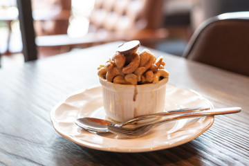cup of cake on wooden table in cafe
