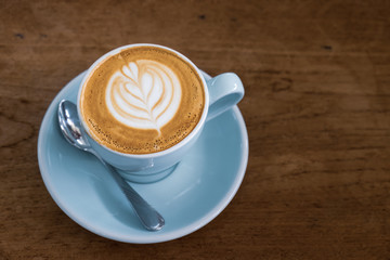 cup of coffee on wooden table