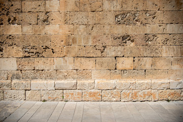 Ancient Brickwall Texture Background. The Wall of a Spanish Church made out of Sandanstone, Mallorca, Spain