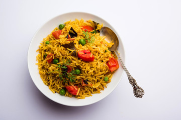 Tomato  pulav/Pilaf made using basmati rice, served in a bowl. selective focus