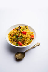 Tomato  pulav/Pilaf made using basmati rice, served in a bowl. selective focus