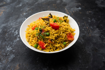 Tomato  pulav/Pilaf made using basmati rice, served in a bowl. selective focus