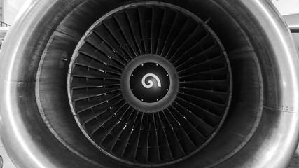 Close-up view of the jet engine of the aircraft. Black and white photo.