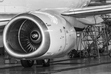Close-up view of the jet engine of the aircraft. Black and white photo.