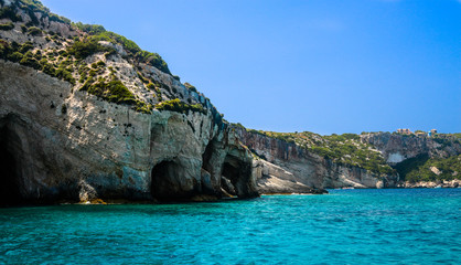 View on rocky shore of Zakynthos Island and crystal clear water of Ionian Sea.