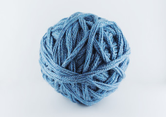 A large ball of blue wool. Cozy accessories. Materials for knitting.