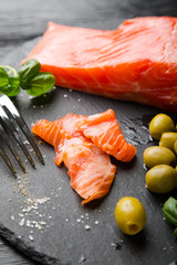 Smoked Salmon Slices with Olives and Basil