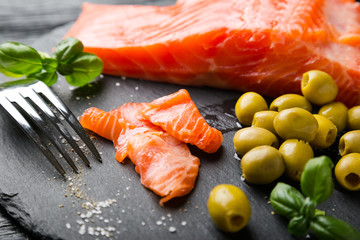 Smoked Salmon Slices with Olives and Basil