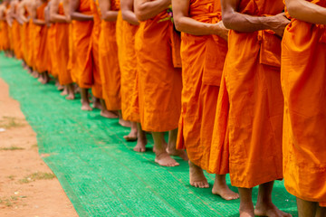 There was a merit making in the morning. People would scoop food into the alms of many monks.