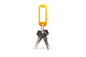 Two keys and an orange label set on a white background.