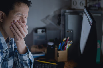 Men are gagging while yawning on the office desk in night time with overtime