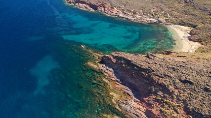 Fototapeta na wymiar Aerial drone bird's eye view photo of iconic turquoise clear water sandy beach of Agios Sostis in island of Mykonos, Cyclades, Greece