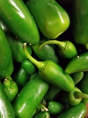 Farm Fresh Organic Jalapeno Peppers. Bright and colorful summer vegetables. Crisp and delicious. Diet food. Healthy and vibrant. Farm stand vegetables. Salad ingredients.