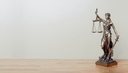 Lady Justice Statue on a table. Panoramic image with copy space. 