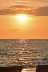 Golden Sunset at the Beach with Boat