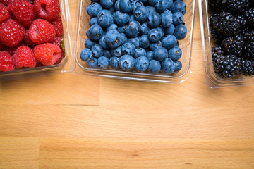 Assorted Berries on wood background
