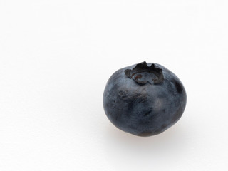 Ripe blueberry (blueberry) berries on a white background. Close-up. Still life.