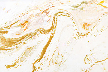 Marble golden, orange and white raster texture. Mineral stone macro surface. Color liquid flow, fluid effect wallpaper. Acrylic, oil paints mixing dynamic backdrop.