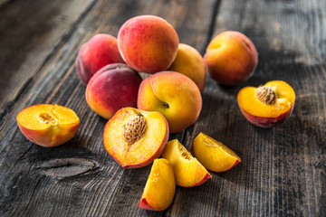 Naklejka na ściany i meble Fresh organic peaches on old wooden table