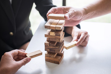 Alternative Risk and Strategy in Business, Hand of business team cooperative gambling placing...