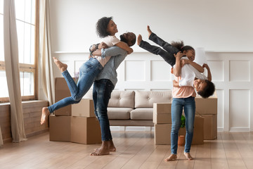 Funny african parents kids celebrate moving day in new house