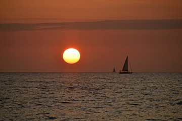 Red Sunset at the Beach with Boat