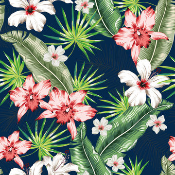 Tropical pink orchid, white hibiscus flowers, banana palm leaves, navy background. Vector seamless pattern. Jungle foliage illustration. Exotic plants. Summer beach floral design. Paradise nature