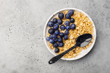 Healthy balanced breakfast. Whole grain caramel granola, fresh organic blueberries. Minimalism.