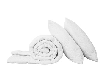 Stack of bedding on the white background, two white pillows on the rolled duvet isolated, bedding objects isolated against white background, bedding items catalog illustration, bedding mock up