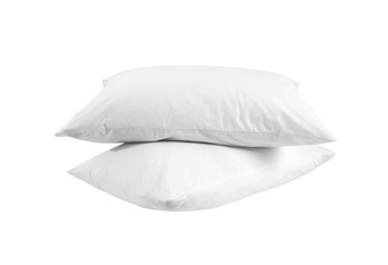 Two white pillows isolated,  stack of pillows on a white background, two pillows piled against white background. Side view.