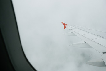 View from window flight on air with flight wing with beautiful blue sky and cloud