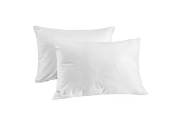 Two white pillows isolated, pillows on a white background, two pillows piled against white background. Top view.