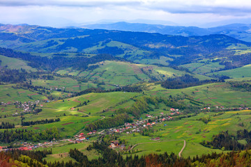 Fototapeta premium Beautiful landscape of the Carpathian mountains, Ukraine. View of the village from the top of the mountain.