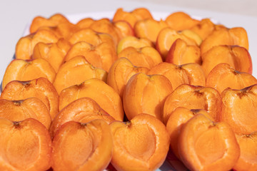 Opened apricot halves cooked for further processing