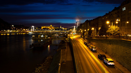 Fototapeta na wymiar View from Liberty Bridge on the night Danube, Erzhebet Bridge. Fireworks in the night sky