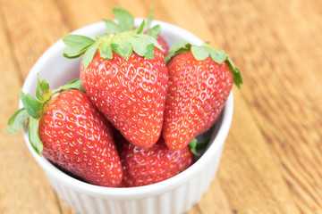 Close-up fresh strawberry. Wooden background.