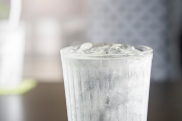Glass of drinking ice water with ice cube placed on table with bokeh background.Water Drinking...