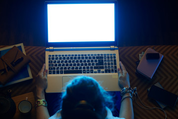 elegant woman looking blue light computer screen on laptop