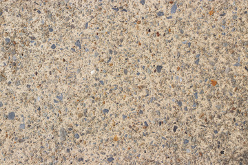 Beige stone pebble wall texture