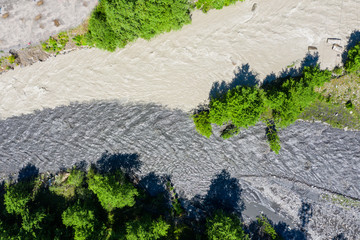 amazing view of the confluence of two rivers with different colors of water. The two mountain...