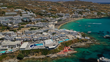 Aerial panoramic photo of famous turquoise clear sea celebrity sandy beach and bay of Psarou with...