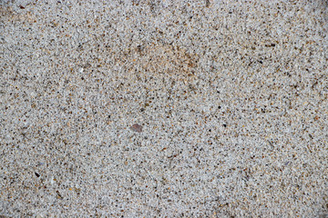 white painted stucco pebble wall