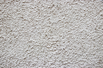White painted stucco pebble wall texture